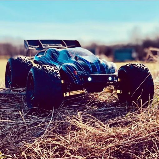 JLB Racing Cheetah 21101 1/10 RC Car para Adultos con Motor sin Escobillas, Camiones RC 4WD Todo Terreno, 80km/h con ESC de 120A y Motor sin Escobillas de 3670 2500KV Funcion de Wheelie