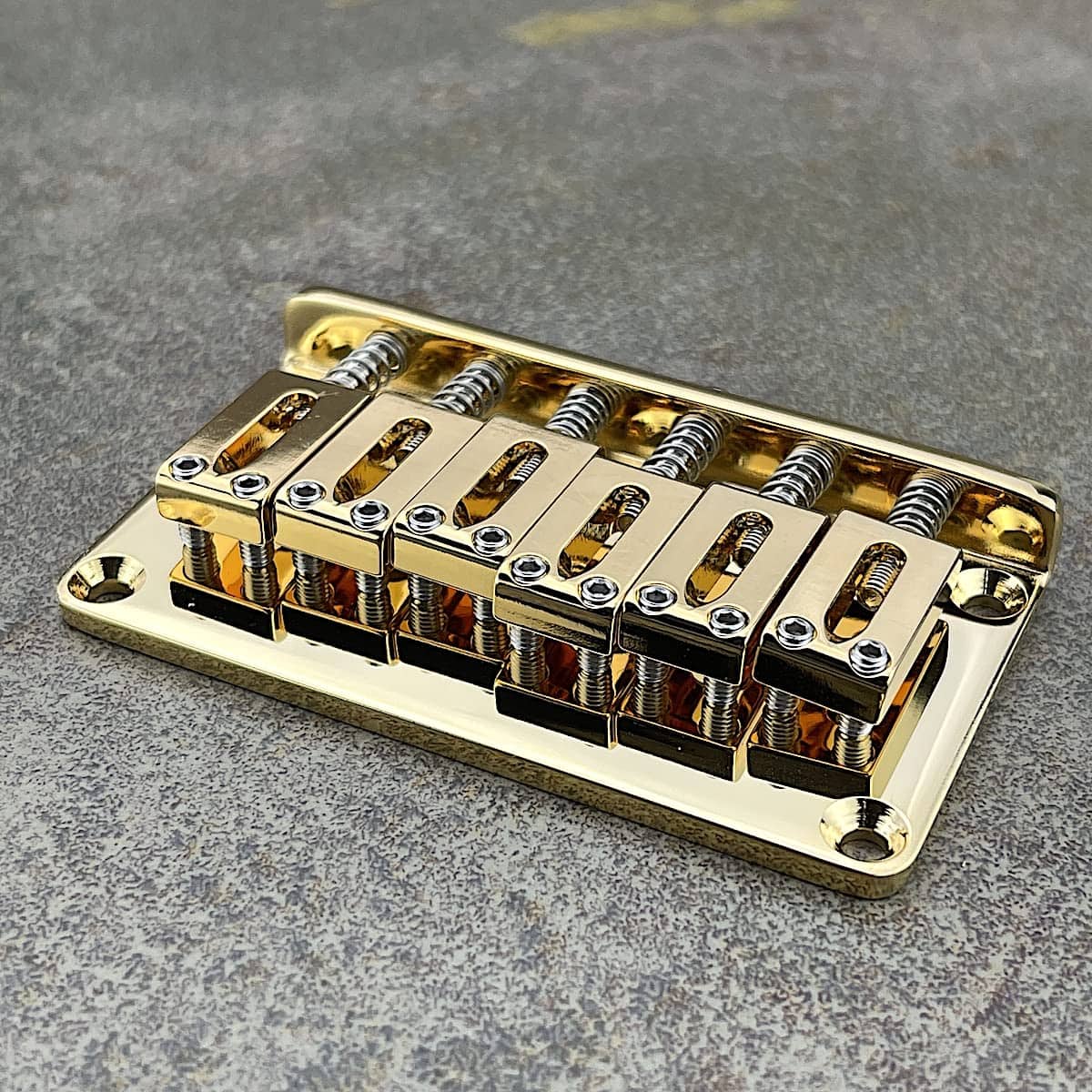 Puente rígido Gotoh con selleta de latón bañada en oro