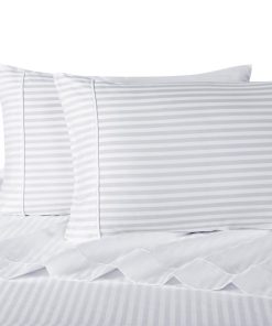 Juego de sábanas a rayas blancas de la marca Royal Hotel,