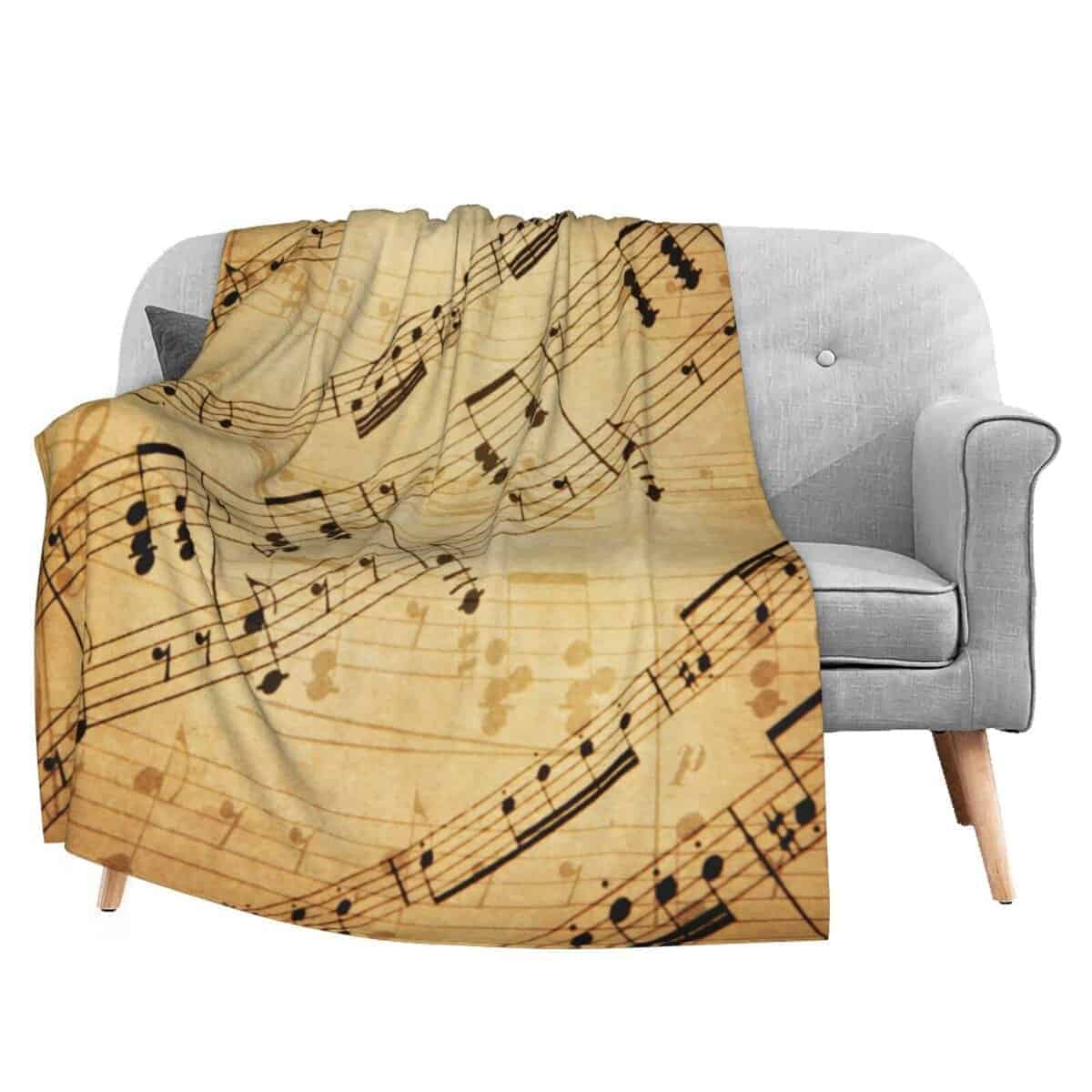 Manta de franela con estampado de partituras de música